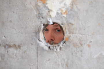 Broken cement wall photo with clipping path of the hole.