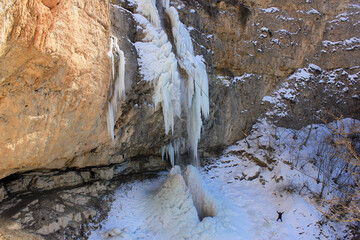 Beautiful frozen Afurja waterfall in the mountains. Afurja village, Guba region, Azerbaijan.