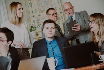 Conflict on business meeting with team.