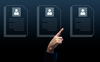 female hand selects a candidate's resume on a virtual screen. The concept of finding employees, career advancement