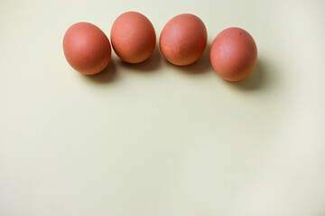 Brown eggs on a light isolated background for copyspace, text