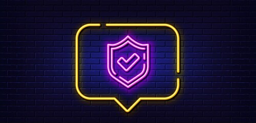 Neon light speech bubble. Check mark line icon. Accepted or Approve sign. Tick shield symbol. Neon light background. Confirmed glow line. Brick wall banner. Vector