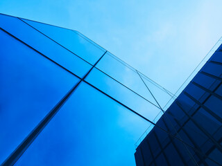 Fototapeta na wymiar Architecture details Modern Glass facade Background Blue reflect