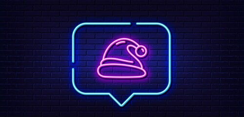 Neon light speech bubble. Santa hat line icon. Christmas or New year sign. Claus symbol. Neon light background. Santa hat glow line. Brick wall banner. Vector