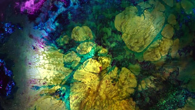 Abstract spots of blue green and yellow alcohol ink. Retro background