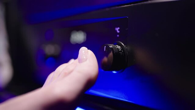 Person feet big toe push out and turn button and turn on oven 4K