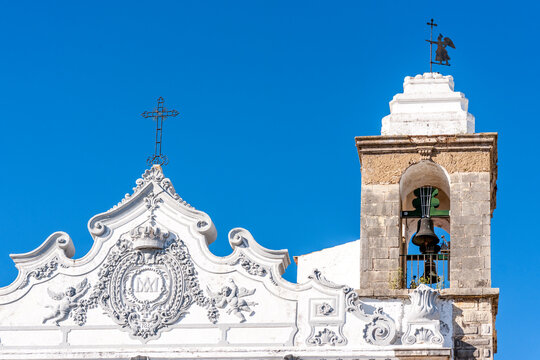 Portugal, Algarve, Olhao, Bell tower and roof reliefs of Igreja de Nossa Senhora do Rosario Church