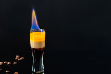 B-52 cocktail flambe (flamed) - layered shot composed of coffee liqueur, Irish cream and orange liqueur