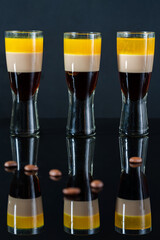 B-52 cocktail - layered shot composed of coffee liqueur, Irish cream and orange liqueur