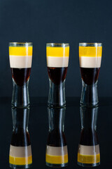 B-52 cocktail - layered shot composed of coffee liqueur, Irish cream and orange liqueur