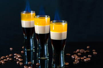 B-52 cocktail flambe (flamed) - layered shot composed of coffee liqueur, Irish cream and orange liqueur