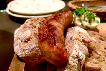 Homemade sausage with pieces of delicious bread, homemade food.