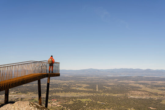 Spain, Province of Caceres, Male hiker admiring view of Monfrague National Park from viewing platform
