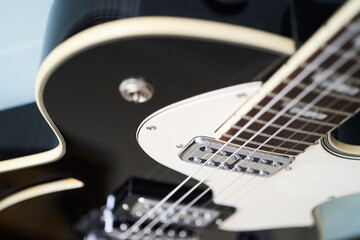 Fototapeta na wymiar detail photo of an black electric guitar