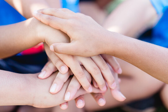 Group Of Volunteers Kids Children Hands Joining Hands Together, Unity Ready Fight.teamwork And Partner.Sport Day Student At School.Next Generation Co Operation.Friendship. Initiative Volunteer Team.