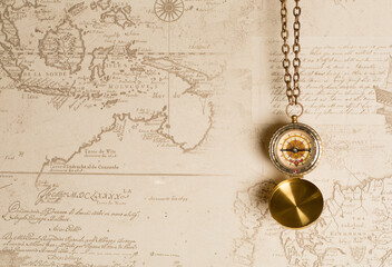 Old vintage compass on map background