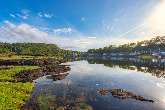 Picturesque Plockton village reflecting on lake, Scotland