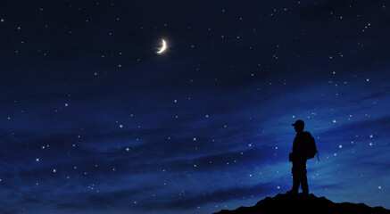 Success achievement concept. Silhouette of person standing on top of mountain at night