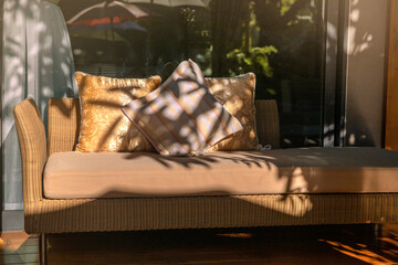 Obraz na płótnie Canvas Outdoor pillows on sofa under brilliant sunlight