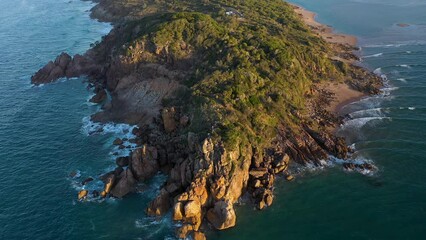 Bustard Bay sunset aerial with the Queensland holiday town of 1770 Seventeen Seventy in the background.