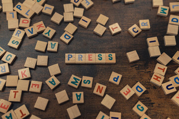 PRESS - composed of wooden alphabet letters the media, journalism concept . High quality photo
