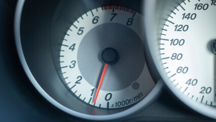 Close up of car dashboard tachometer on blackground