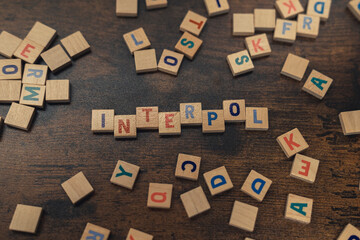 A word INTERPOL made of wooden alphabet letters safety concept . High quality photo