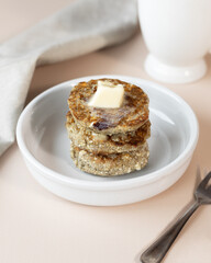 Syrniki, cottage cheese fritters or curd pancakes, made from curd and hemp flour. Low carb Ketogenic diet.