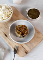Syrniki, cottage cheese fritters or curd pancakes, made from curd and hemp flour. Low carb Ketogenic diet.