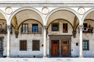 Obraz premium Building with arches along the Piazza della Santissima Annunziata square in Florence, Tuscany, Italy, Europe