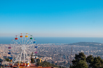 Aerial view (panoramic or landscape) of Barcelona (Catalonia, Spain) from the highest point of the Tibidabo mountain and amusement park