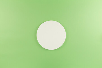 white round circle on green background