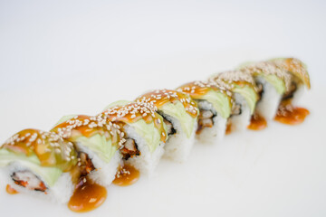 Japanese cuisine roll with avocado and sesame seeds