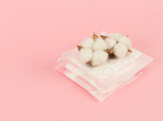 women's pad and cotton on pink background
