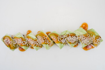 Japanese cuisine roll with avocado and sesame seeds