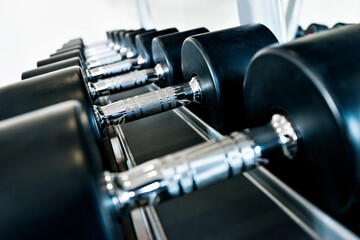 Rows of dumbbells in the gym