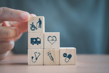 senior's hand holding wooden cube  block, elderly person and disabled person symbol,  health and medical symbol for health insurance ,elderly care, emergency case contact for aging or disabled people