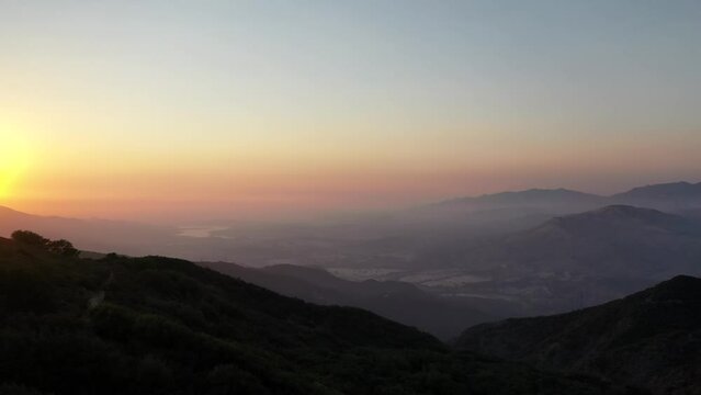 Foggy Sky Over Mountainscape During Sunset. Wide Shot over Lake Cachuma Santa Barbara Hills in California.