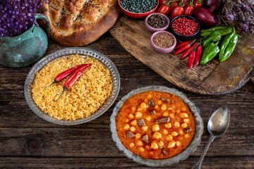 Many kinds of food on the table. Local foods named  etli nohut pilav