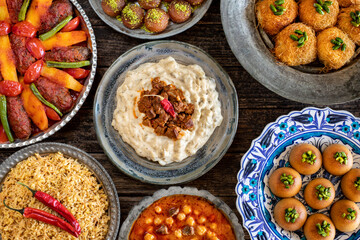 Many kinds of food on the table. Local foods named izmir köfte , hünkar beğendi and etli nohut pilav