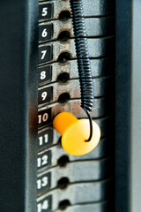 Close up of weight stack with yellow pin