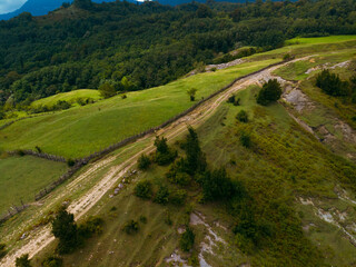 Okace canyon aerial view. The mountains are covered with green forest. Natural landscape. Vacation and Travel. Tourist place in Georgia. difficult dirt road to the point of view