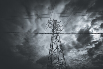 high voltage towers and dramatic cloudy sky