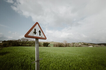 Traffic symbol in countryside landscape