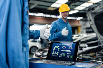 Close up of Automotive mechanic running diagnostics software on tablet