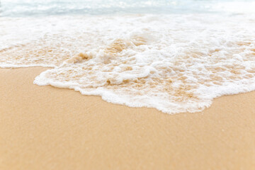 Fototapeta na wymiar Beach sand sea water summer background. Sand beach desert texture