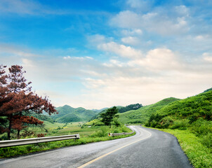 Curved asphalt road in high mountains
