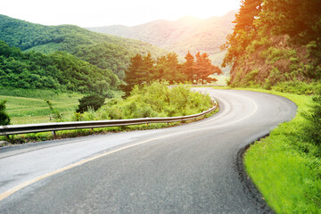 Fototapeta premium Curved asphalt road in high mountains