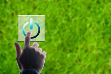 hand pushing a button ON green transition concept