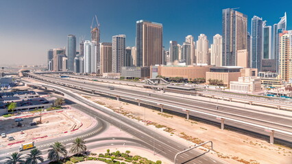 Dubai Marina skyscrapers and Sheikh Zayed road with metro railway aerial timelapse, United Arab Emirates